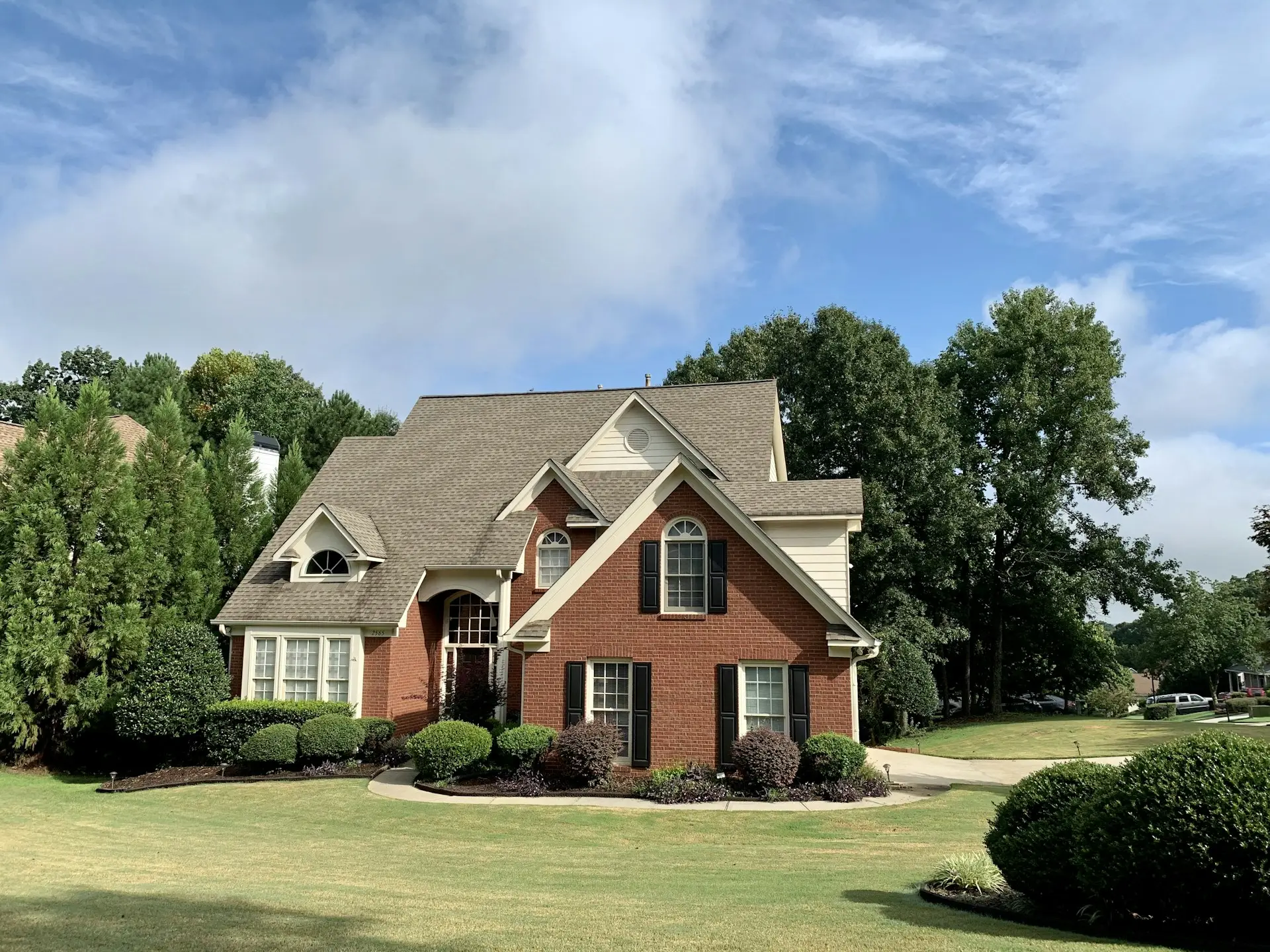 Single-family home exterior with landscaped front yard